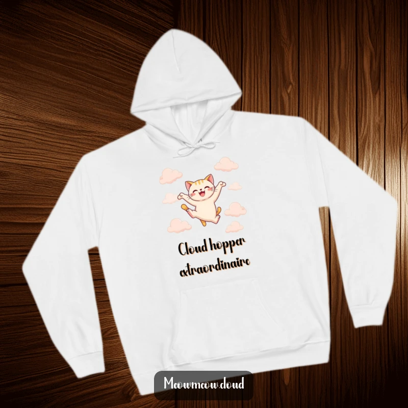 Funny joyful cat leaping between clouds on a cozy hoodie, ideal for dynamic comfort and funny gifts.