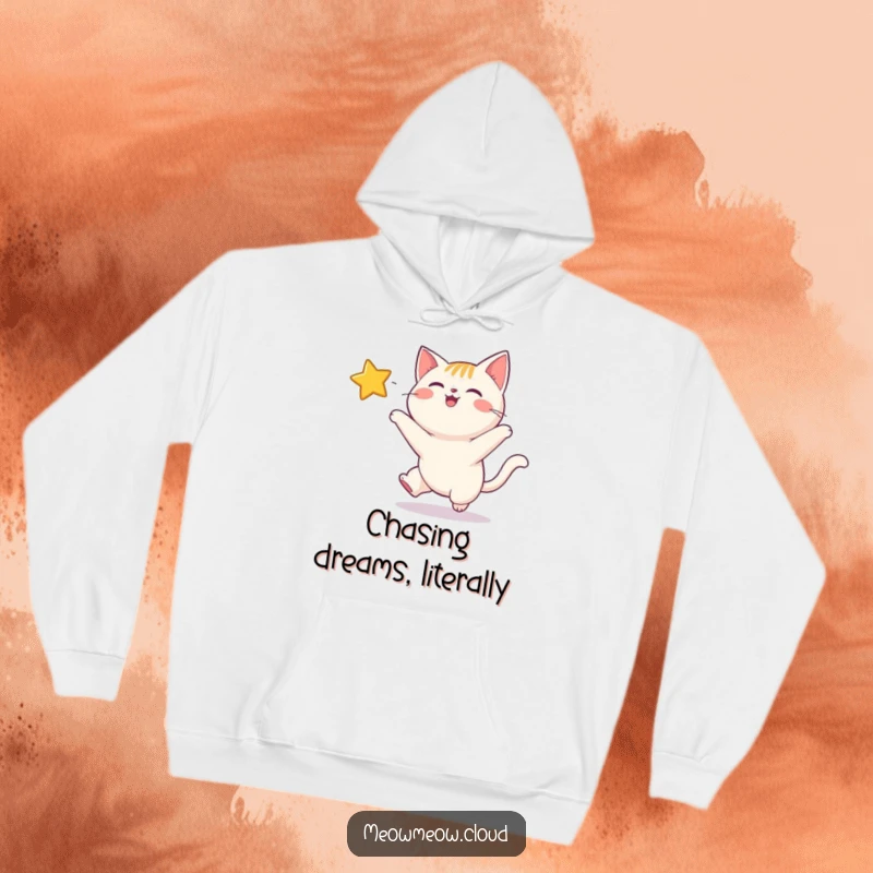 Funny hoodie showing a gleeful cat bounding after a bright, twinkling star, radiating happiness and cosmic ambition.