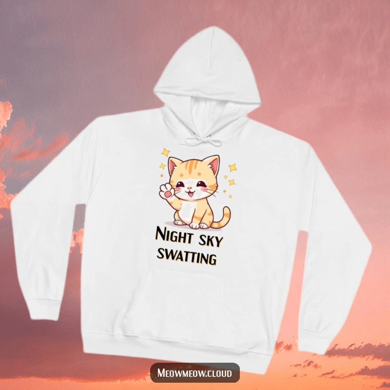 Funny playful cat batting at stars with its paw, a soft and humorous hoodie for cosmic explorers.