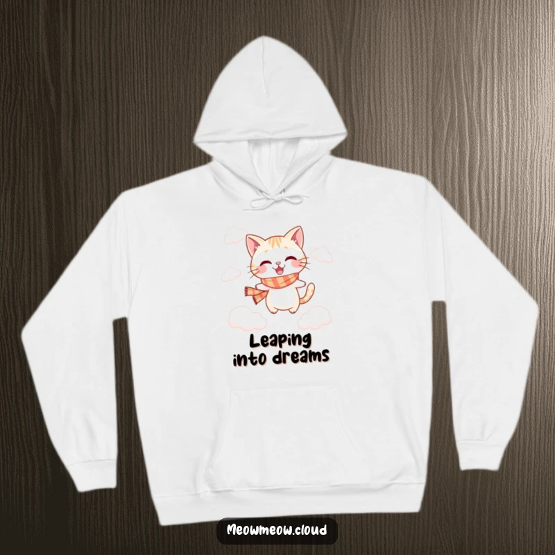Funny jumping cat hoodie depicting a playful cat in a scarf, leaping between soft clouds.
