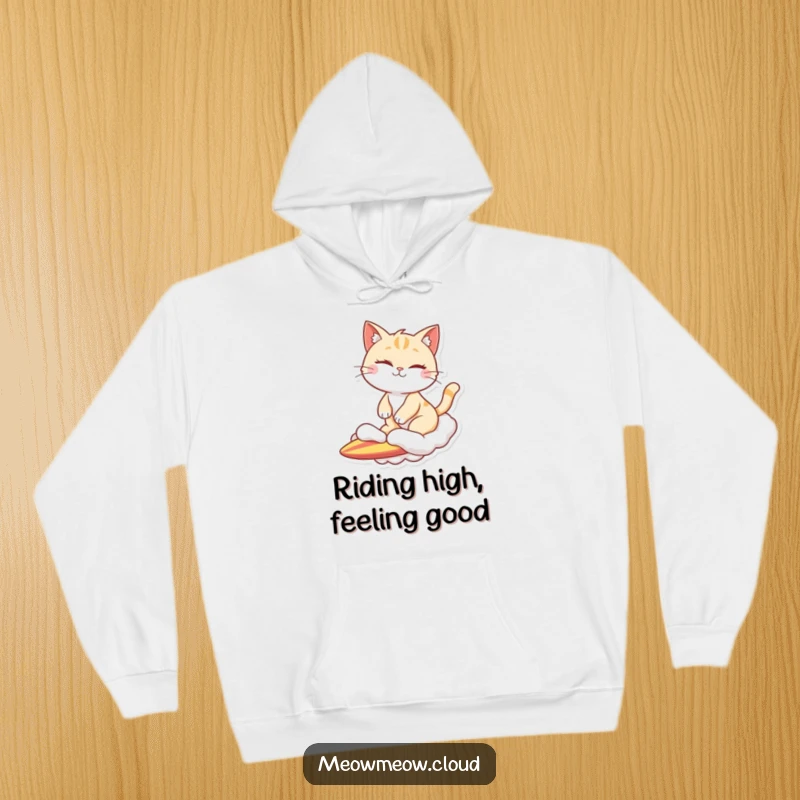 Funny hoodie with a winking cat character surfing on a cloud, offering warmth and a stylishly humorous statement.